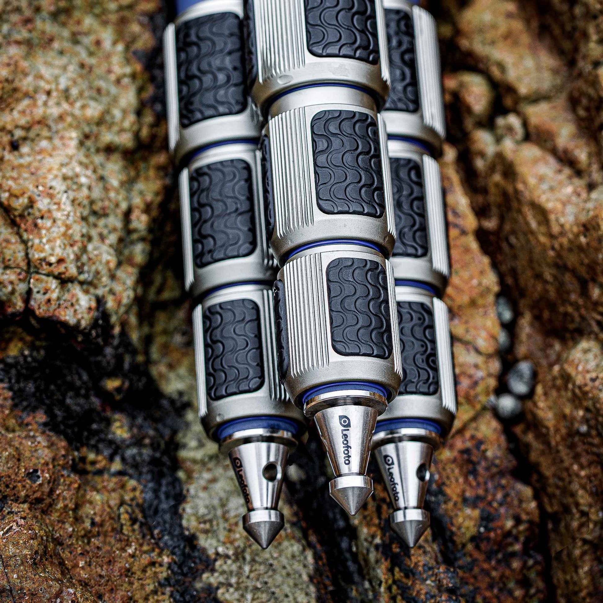 Leofoto LP-324C Poseidon Series water resistant carbon fiber tripod legs with textured grips on rocky surface