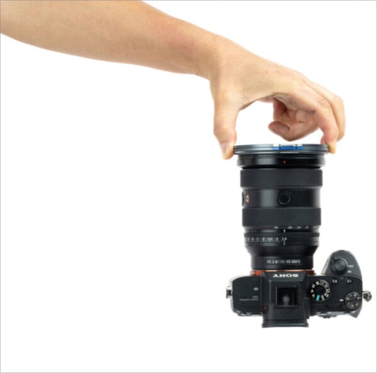 NiSi Natural Night Magnetic Filter being attached to a camera lens for enhanced night photography