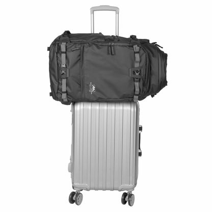 Summit Creative camera backpack placed atop a silver luggage for convenient travel