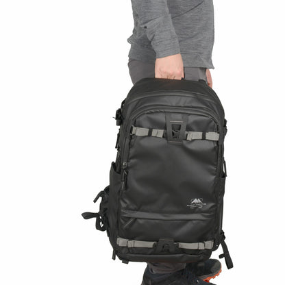 Summit Creative camera backpack in black, designed for photographers on the go with ample storage space