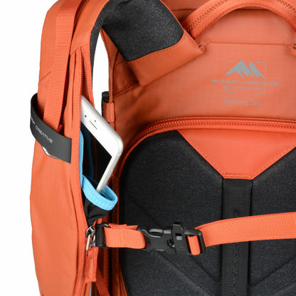 Summit Creative camera backpack in orange with adjustable straps and smartphone pocket for photographers