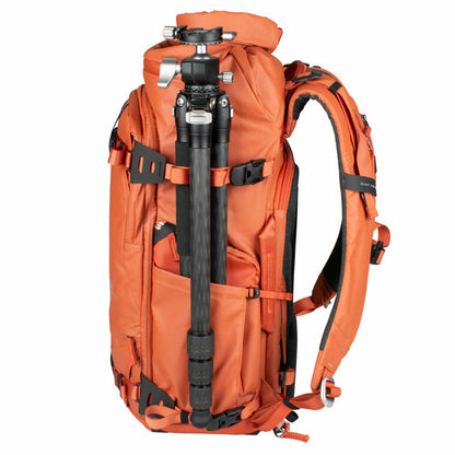 Summit Creative camera backpack in orange with tripod holder and padded compartments for secure gear storage