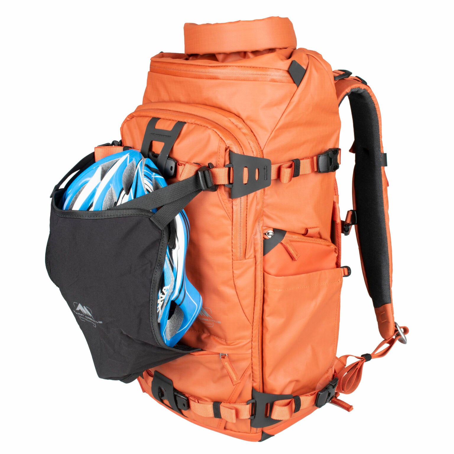 Summit Creative camera backpack in orange, designed for photographers with ample storage and versatile pockets